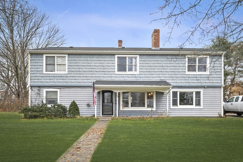 45 Burley Street Danvers, MA 01923 - Photo 2 of 41 a front view of a house with a garden