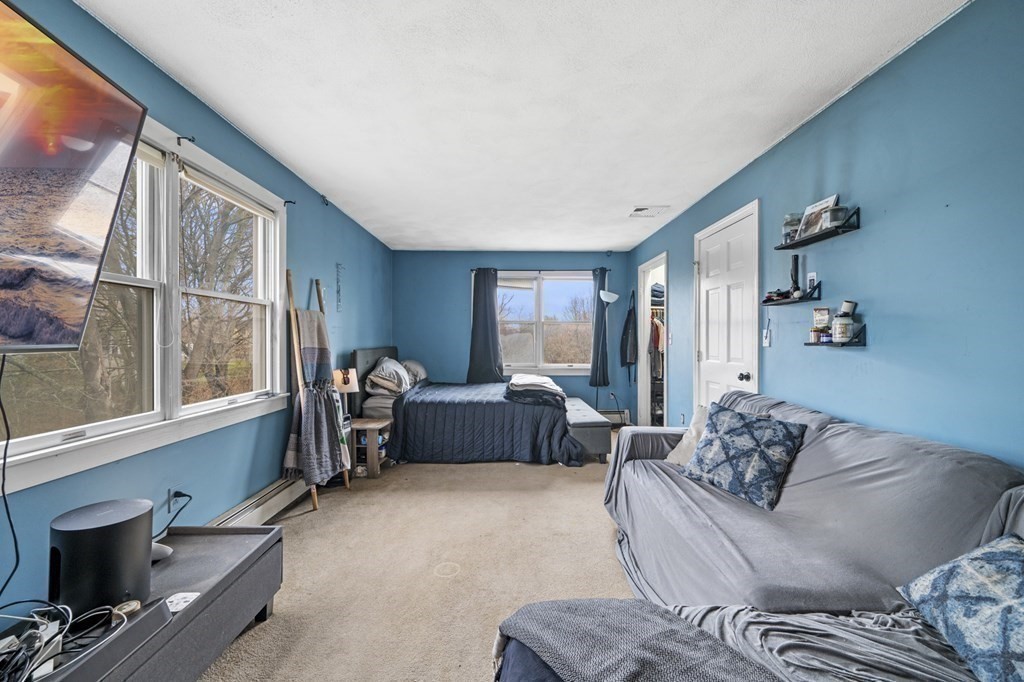 45 Burley Street Danvers, MA 01923 - Photo 22 of 41 a living room with furniture and a window