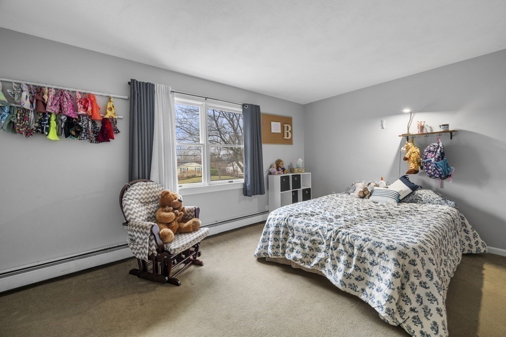 45 Burley Street Danvers, MA 01923 - Photo 24 of 41 a bedroom with bed and a window