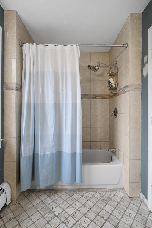 45 Burley Street Danvers, MA 01923 - Photo 26 of 41 a bathroom with a bathtub and shower