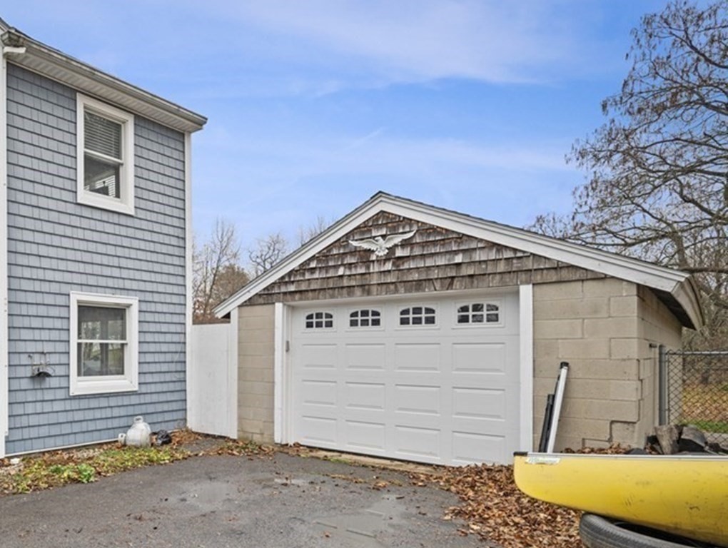 45 Burley Street Danvers, MA 01923 - Photo 31 of 41 a view of a house with a wooden fence