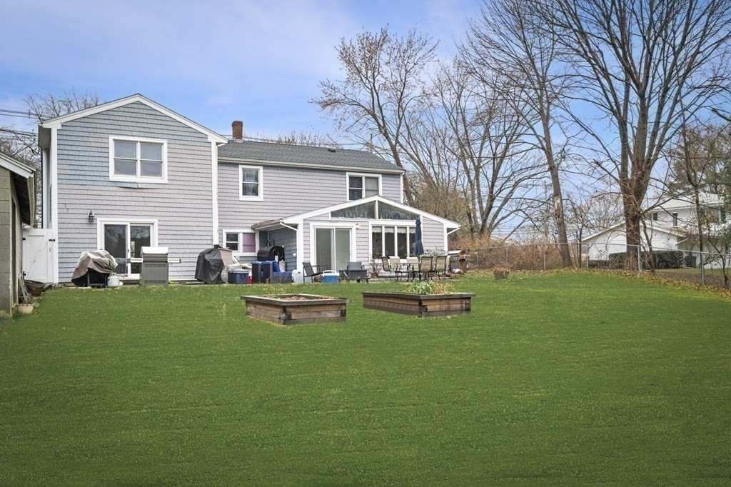 45 Burley Street Danvers, MA 01923 - Photo 32 of 41 a view of a house with backyard and a slide