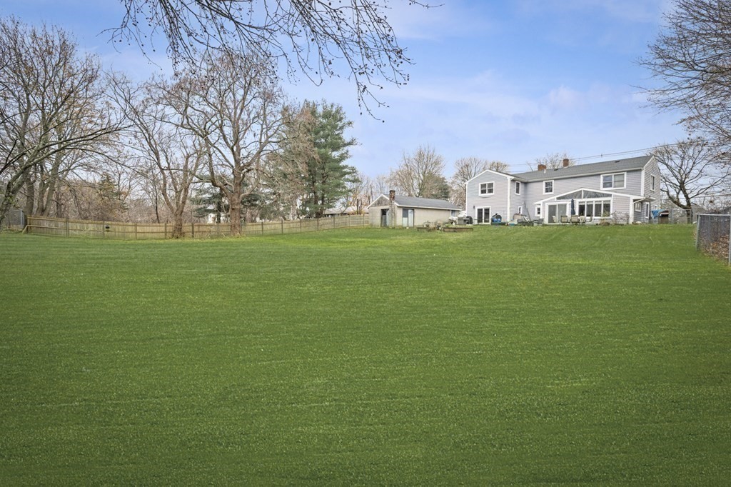 45 Burley Street Danvers, MA 01923 - Photo 33 of 41 a view of a building with a big yard