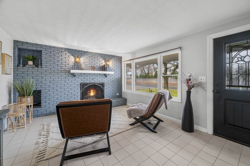 45 Burley Street Danvers, MA 01923 - Photo 6 of 41 a living room with furniture and a fireplace