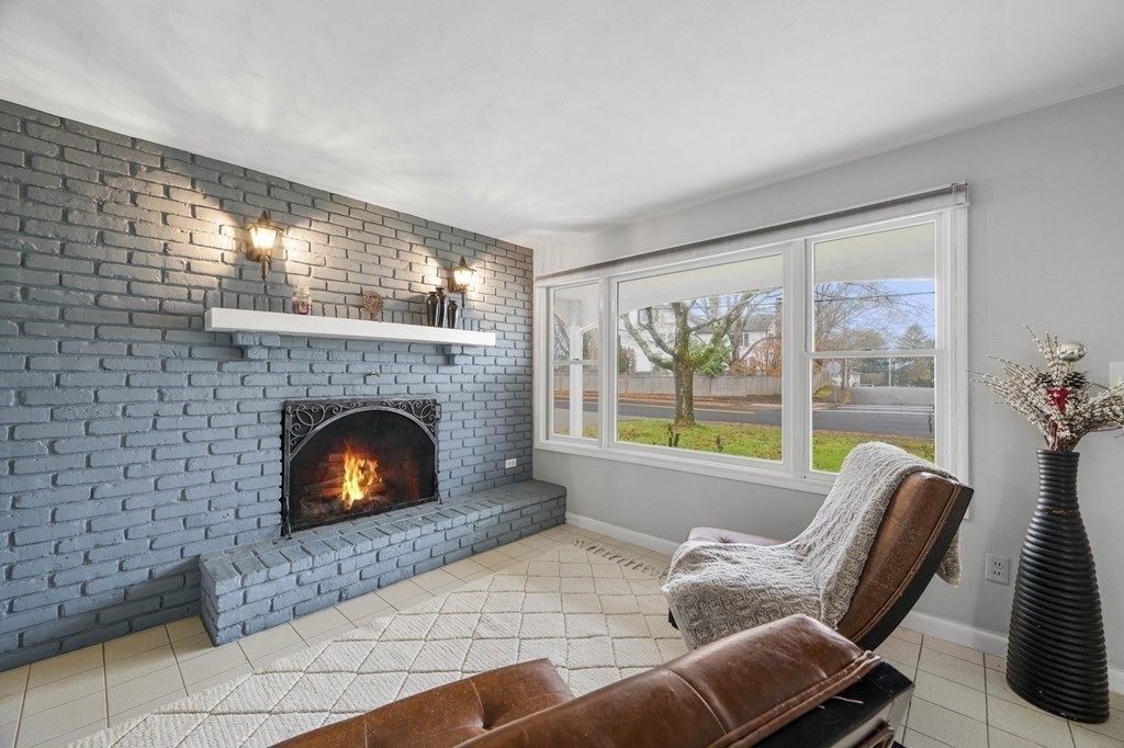 45 Burley Street Danvers, MA 01923 - Photo 8 of 41 a living room with furniture and a fireplace
