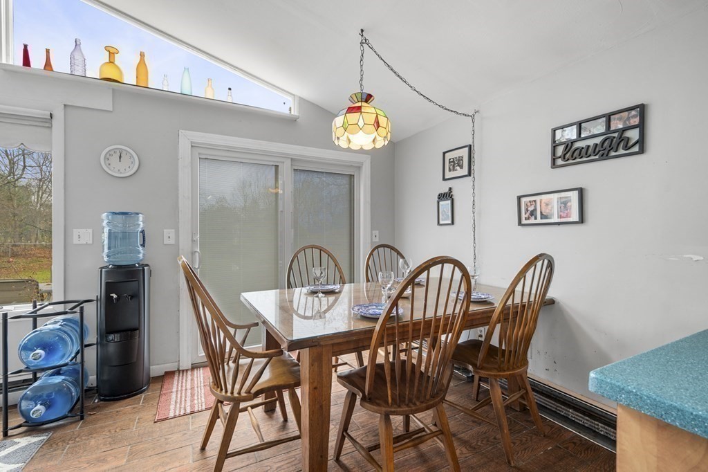 45 Burley Street Danvers, MA 01923 - Photo 10 of 41 a view of a dining room with furniture and chandelier