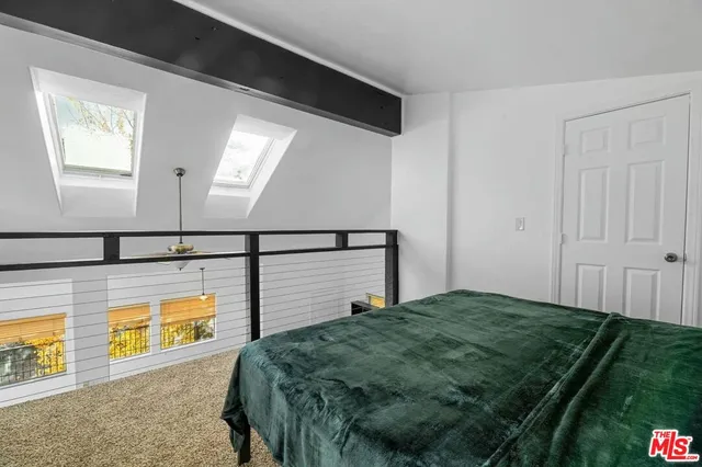 a bathroom with a toilet a sink and shower