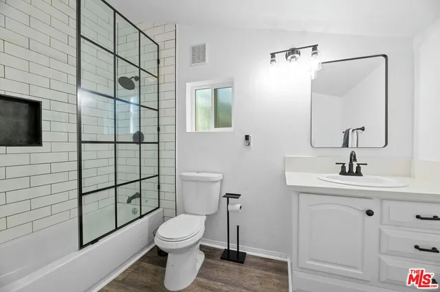 a room with furniture pool table table and chairs