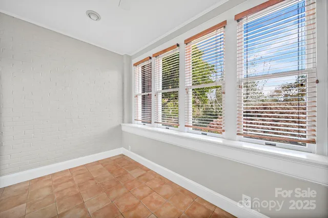 a view of a room that has a window in it