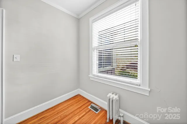 a view of a room that has a window in it