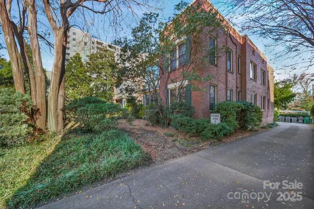 a view of a building with a yard