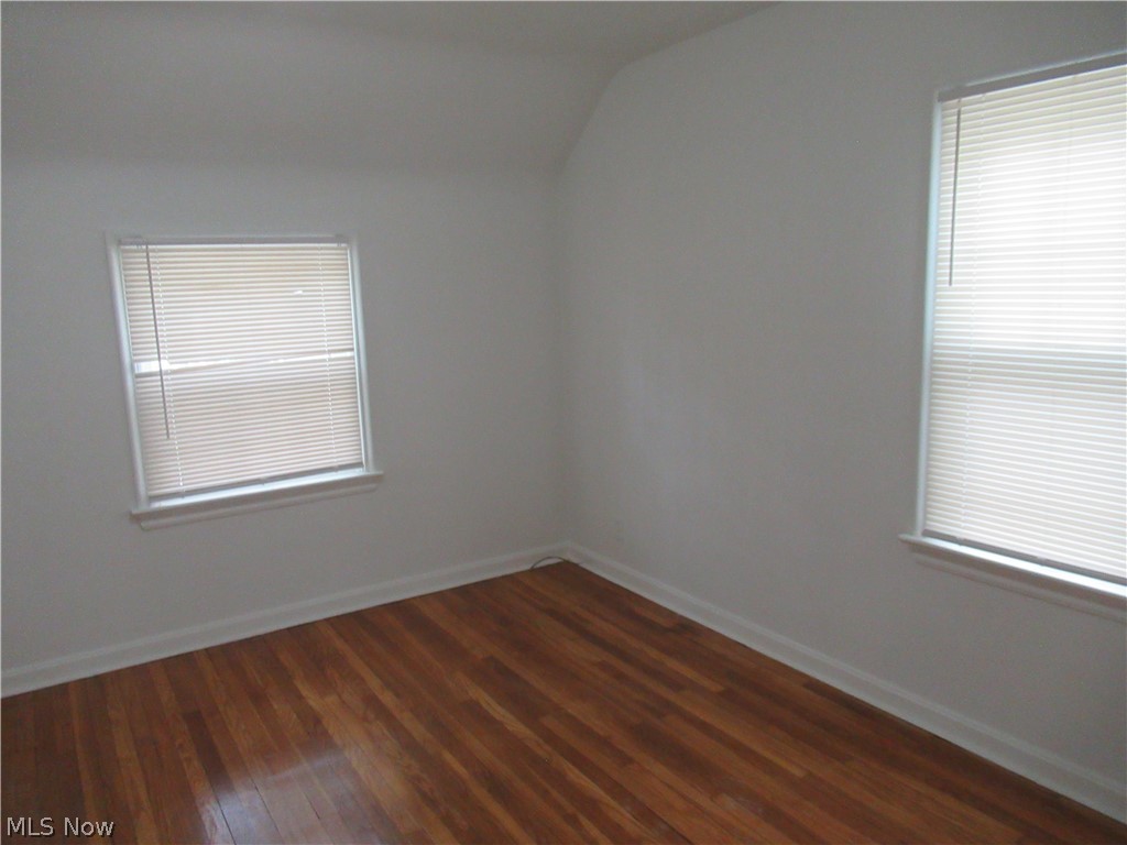 3824 East Antisdale Road Cleveland, OH 44118 - Photo 13 of 27 Interior space featuring wood-finish flooring, white walls, and two windows with blinds