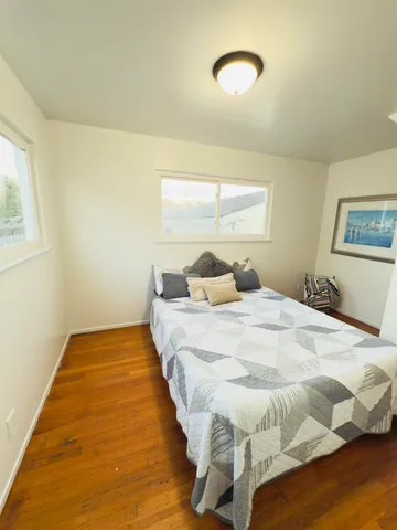 a bedroom with a bed and window