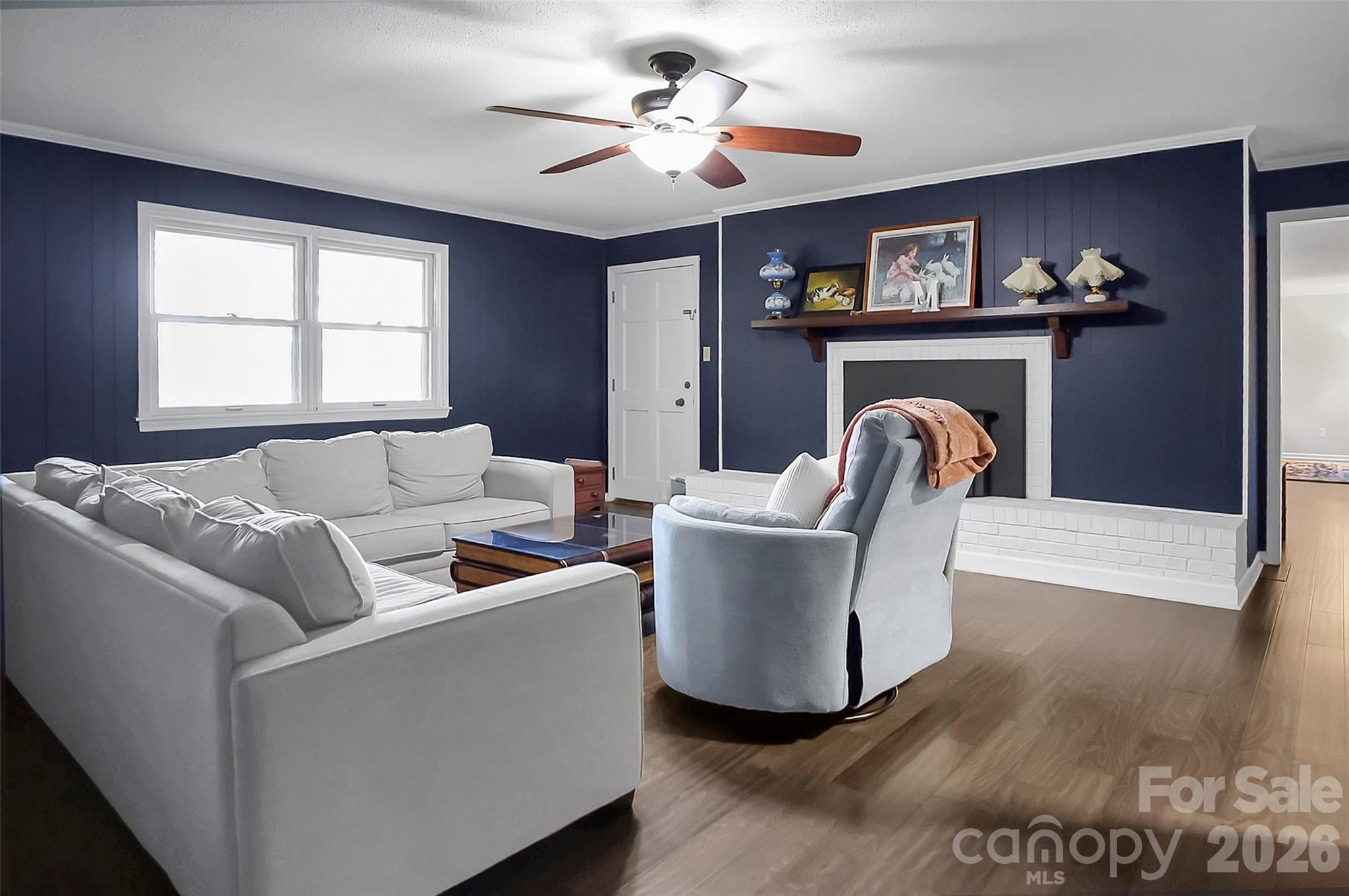 808 Old Mt Holly Road Stanley, NC 28164 - Photo 26 of 48 a living room with furniture and a fireplace