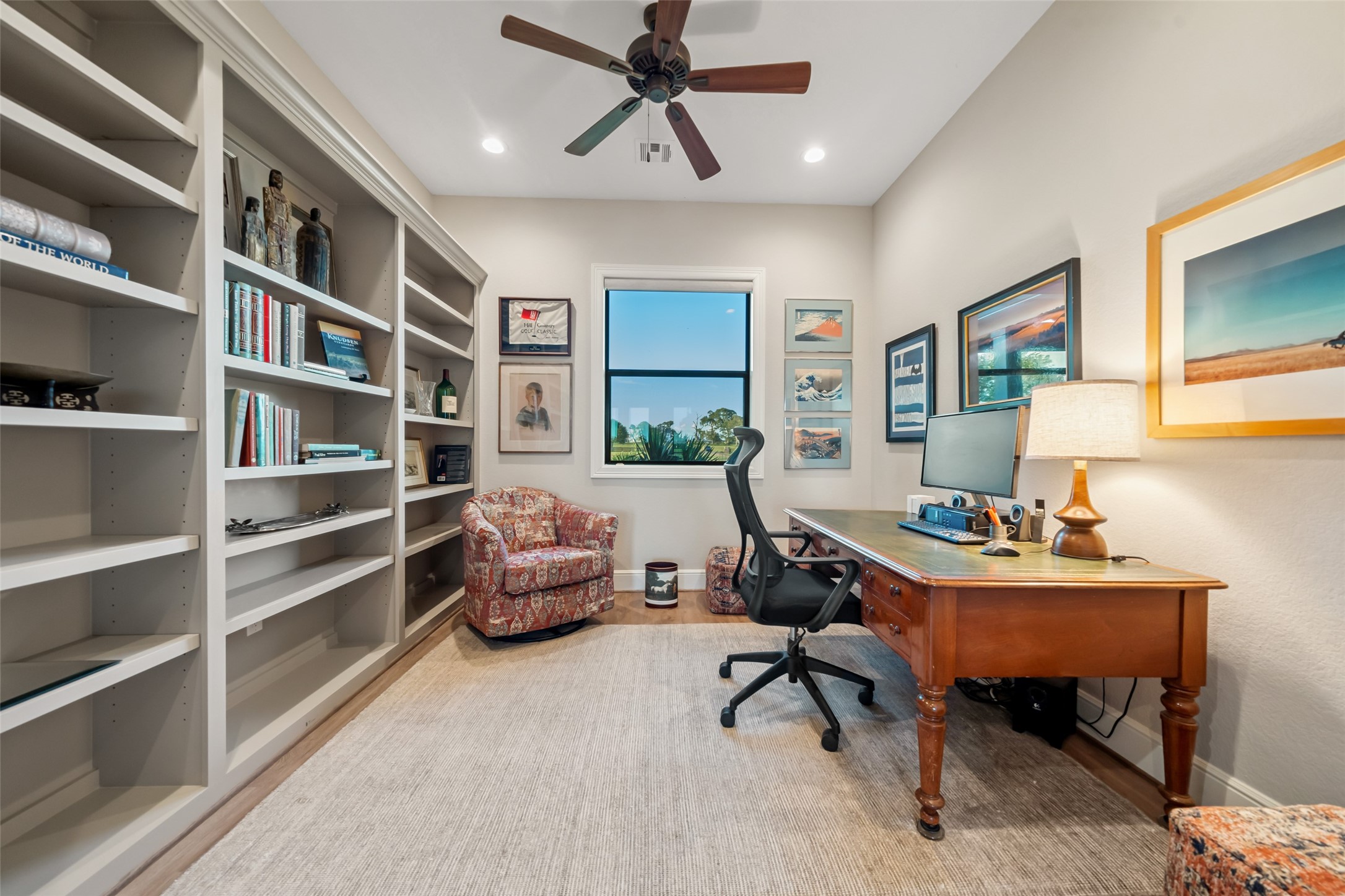 30163 High Spirit Ranch Road Hempstead, TX 77445 - Photo 17 of 47 Custom shelves and a serene view
make this private office ideal for
focused work, tucked just off the
main living space.