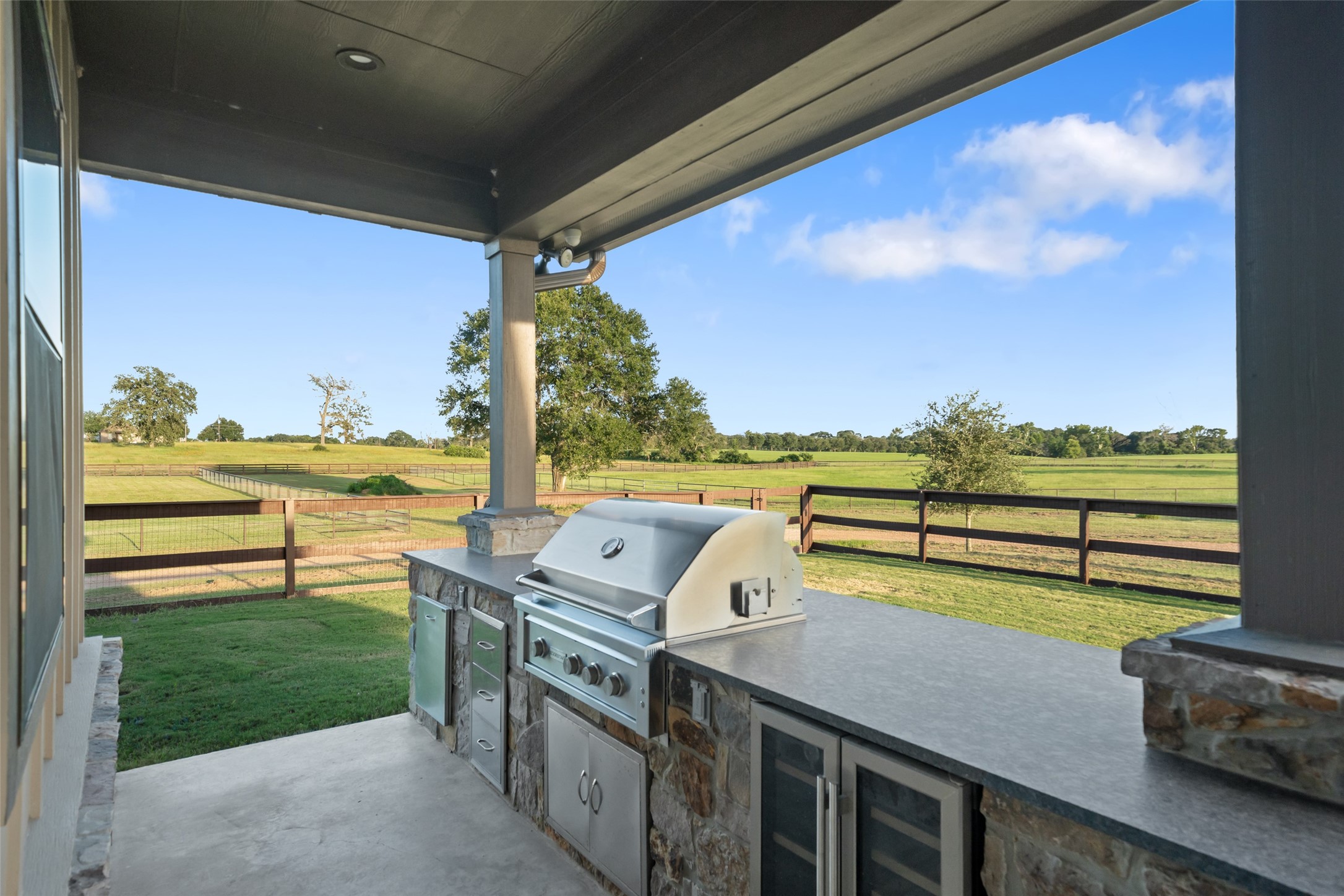 30163 High Spirit Ranch Road Hempstead, TX 77445 - Photo 33 of 47 A dedicated outdoor kitchen with a
stainless steel grill and prep surfaces
makes entertaining a breeze while
overlooking acres of pristine land.