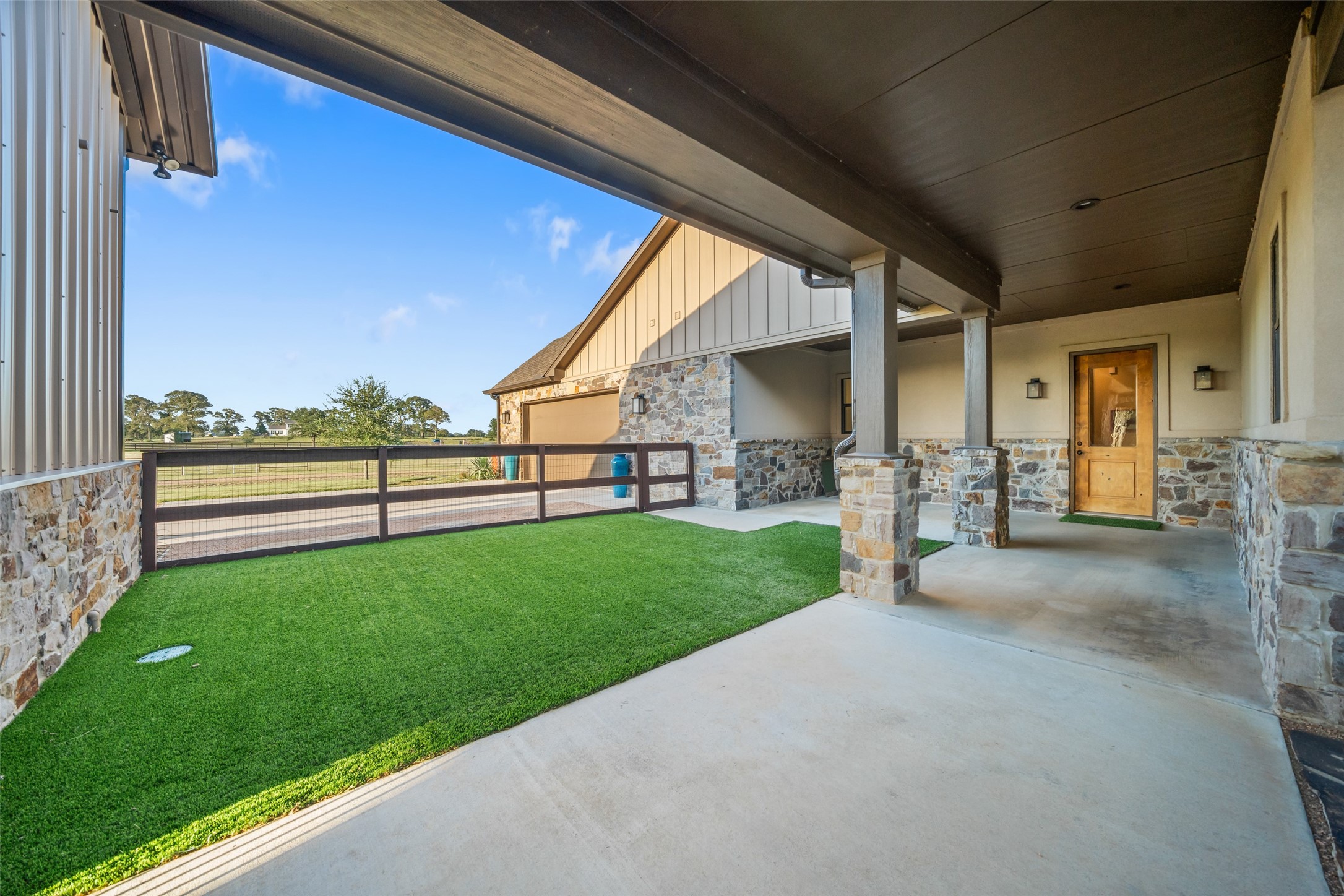 30163 High Spirit Ranch Road Hempstead, TX 77445 - Photo 35 of 47 A breezeway connects the main
home to the garage and barn,
offering covered access and a
fenced area—perfect for pets or as a
safe outdoor space for kids.