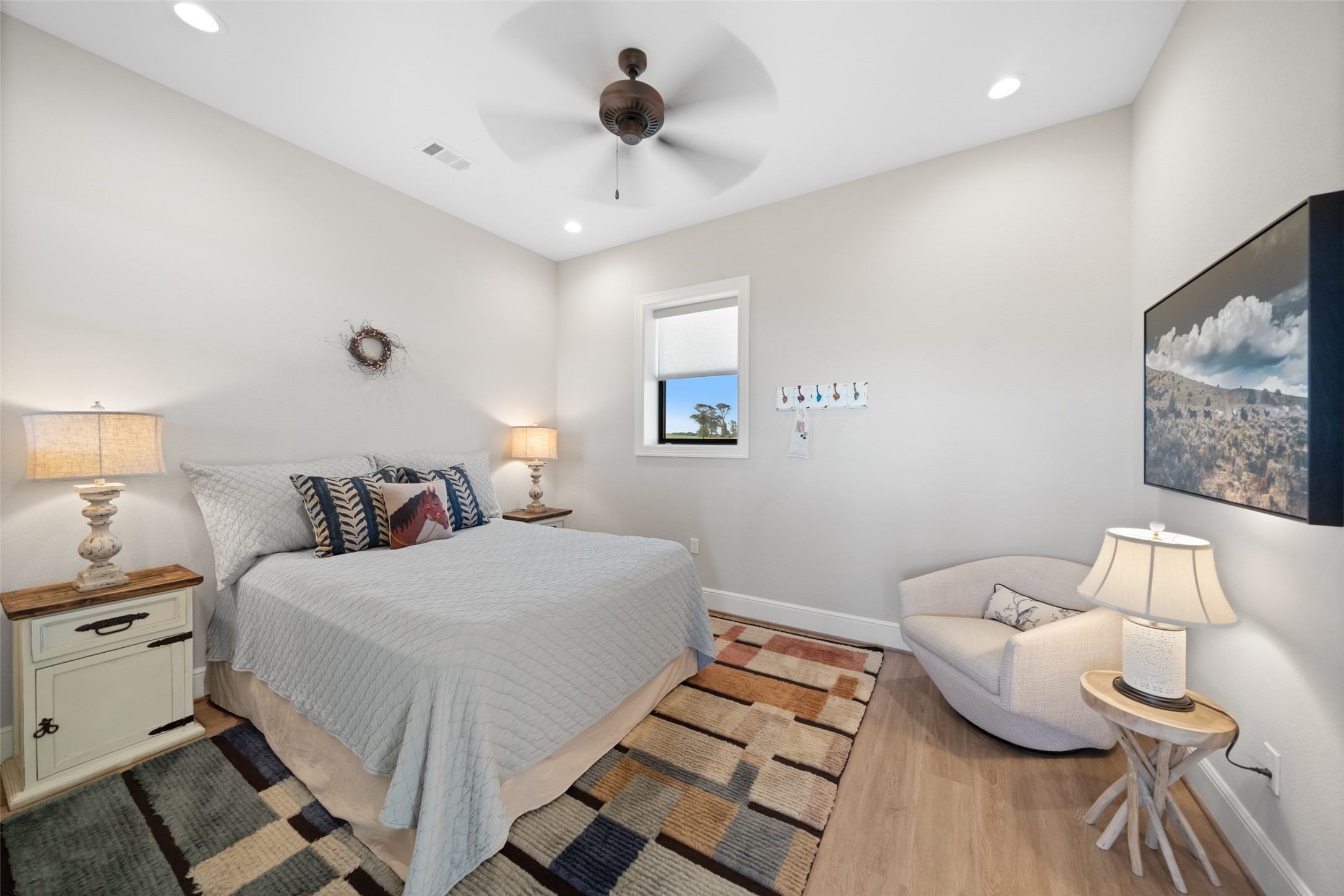 30163 High Spirit Ranch Road Hempstead, TX 77445 - Photo 41 of 47 This inviting guest room in the barn
features soft tones, recessed
lighting, and subtle wood floors