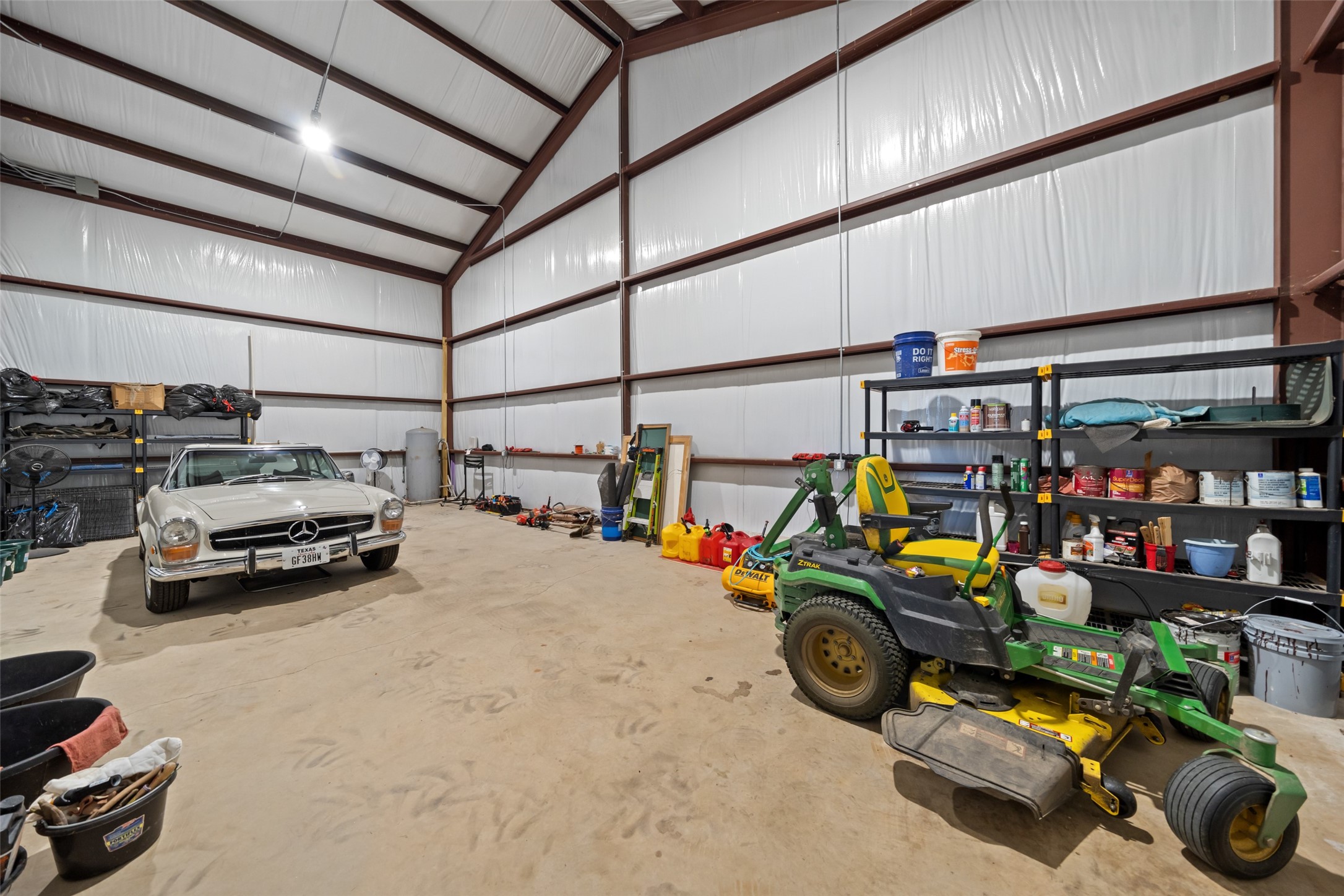 30163 High Spirit Ranch Road Hempstead, TX 77445 - Photo 47 of 47 Inside the metal building, you'll find
expansive storage space, high
ceilings, and durable concrete floors
—ideal for a workshop, equipment,
hobby vehicles, and even a Class A
RV.