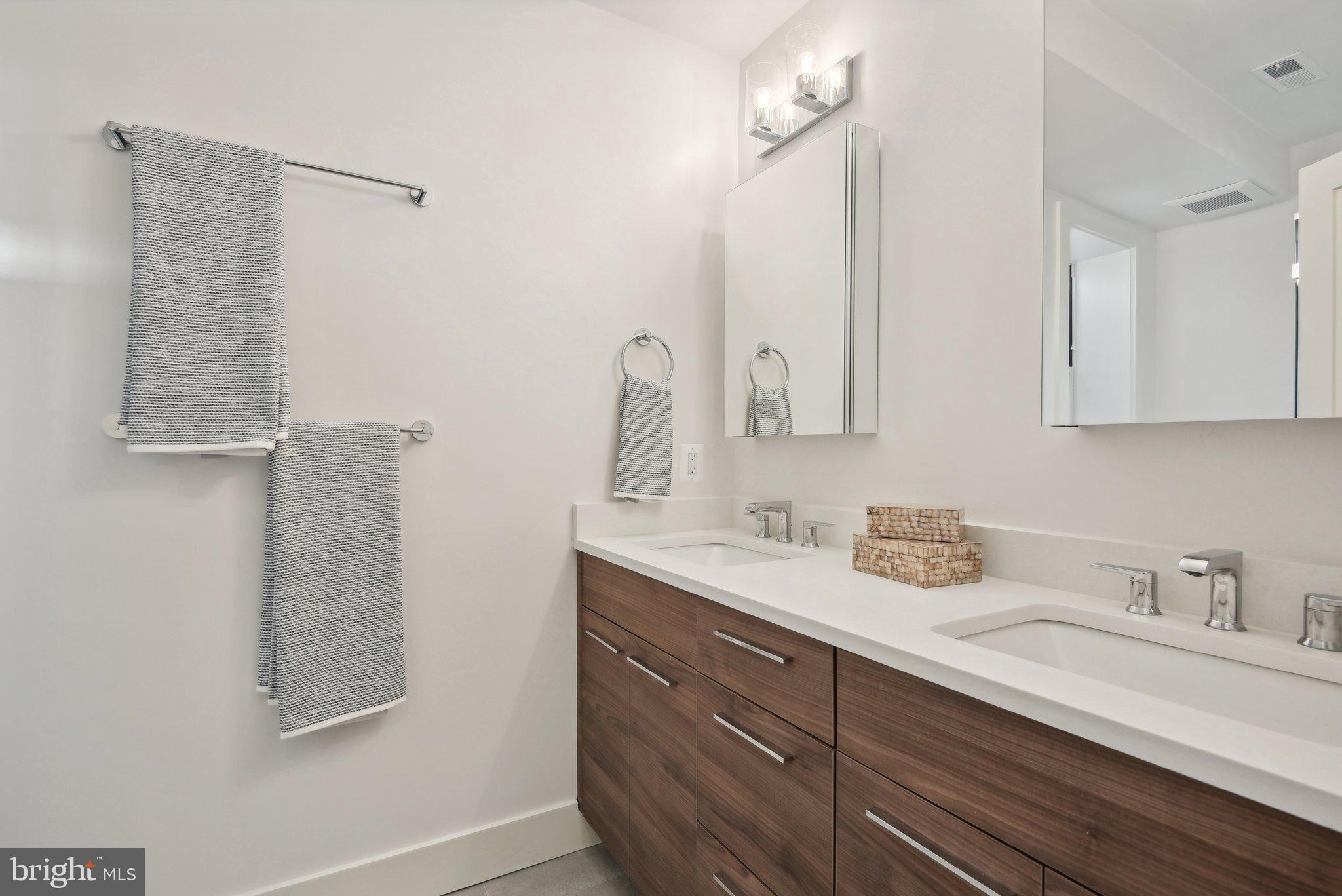 1748 Lanier Place Northwest, Unit 2 Washington, DC 20009 - Photo 15 of 33 a bathroom with a sink and a mirror
