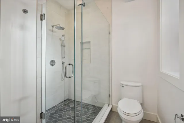 a bedroom with a bed and a chair