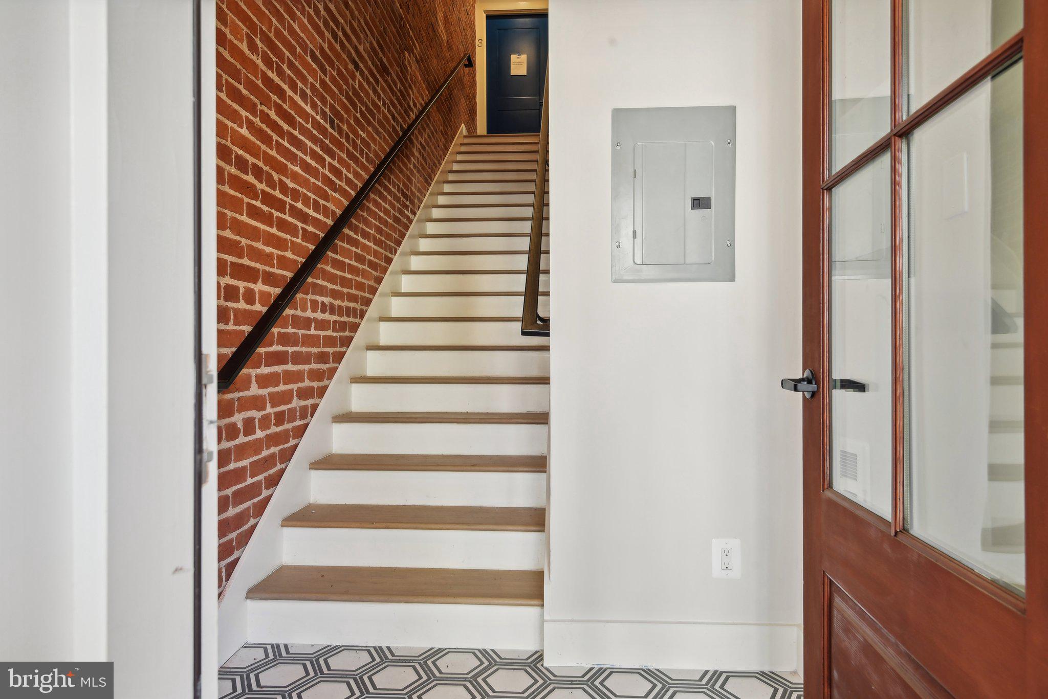1748 Lanier Place Northwest, Unit 2 Washington, DC 20009 - Photo 30 of 33 a view of entryway with wooden floor and stairs