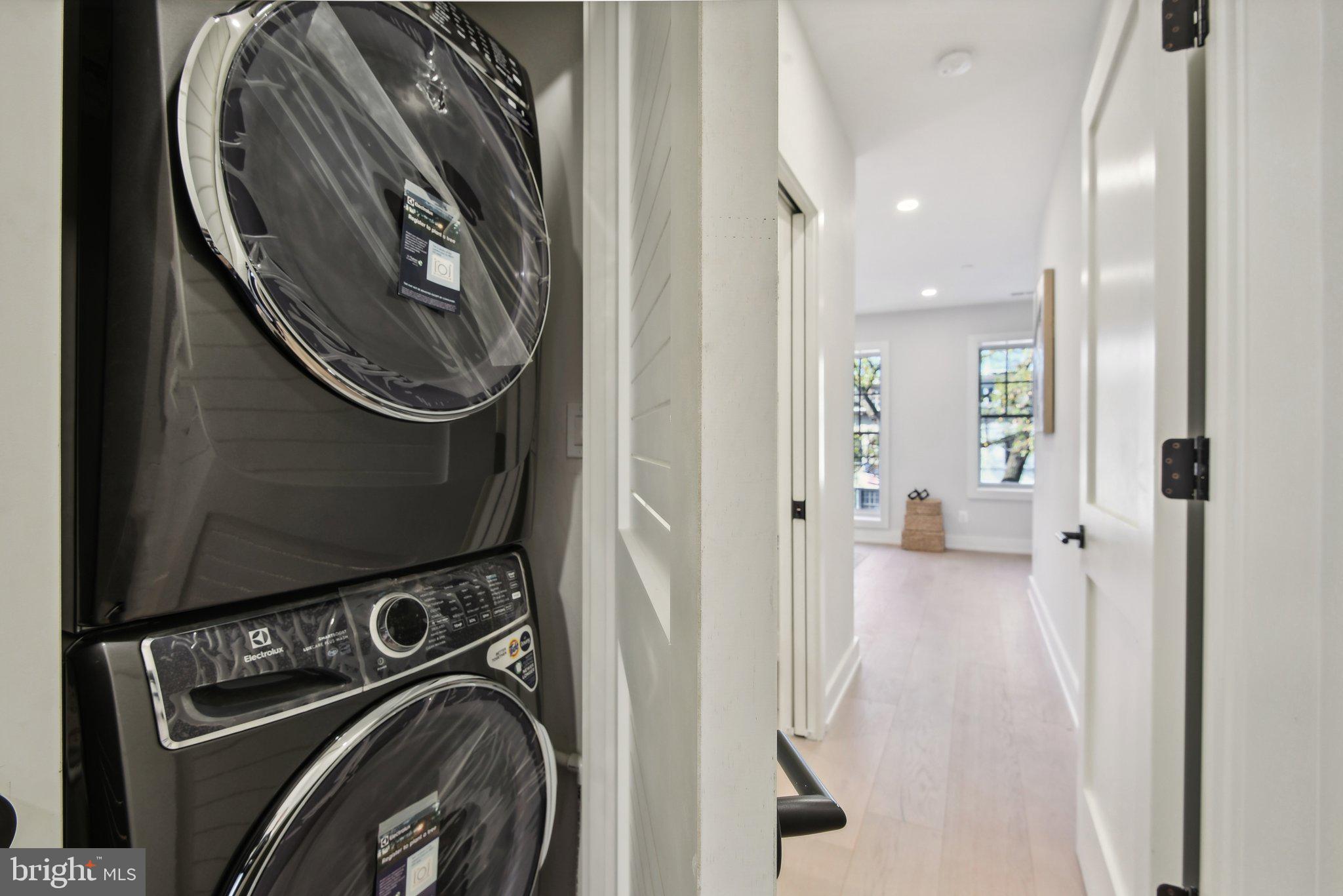 1748 Lanier Place Northwest, Unit 2 Washington, DC 20009 - Photo 8 of 33 a view of a storage and utility room with washer and dryer