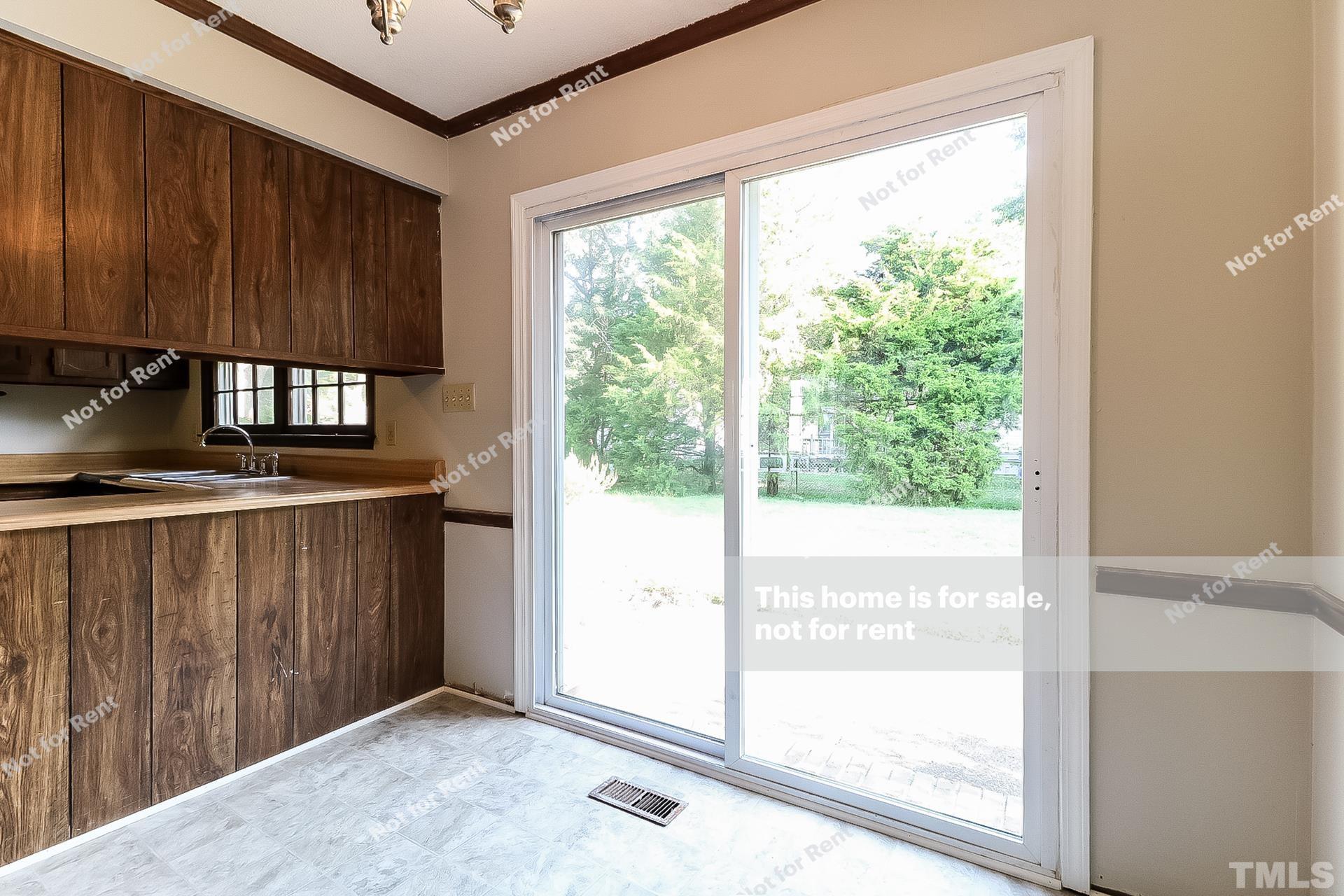 3729 Dusty Lane Raleigh, NC 27604 - Photo 12 of 27 a view of a front door and wooden floor