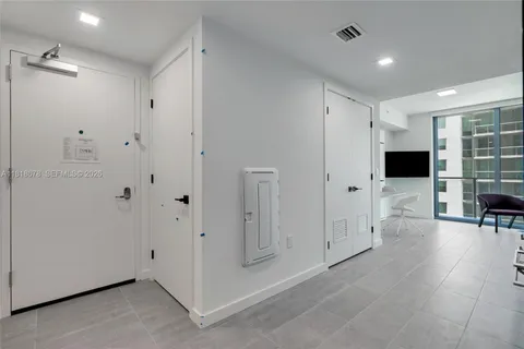 a view of a livingroom with bathroom