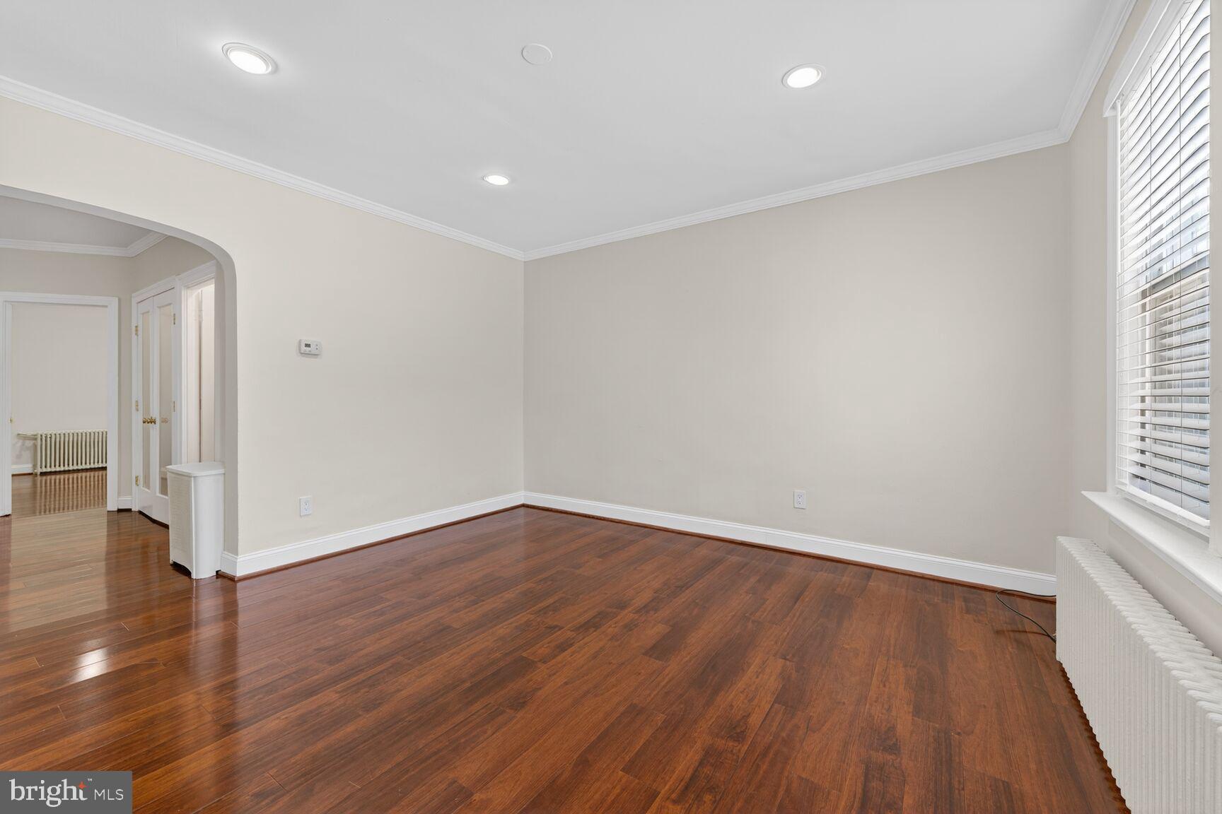 1618 18th Street Southeast, Unit 1 Washington, DC 20020 - Photo 4 of 21 an empty room with wooden floor and windows