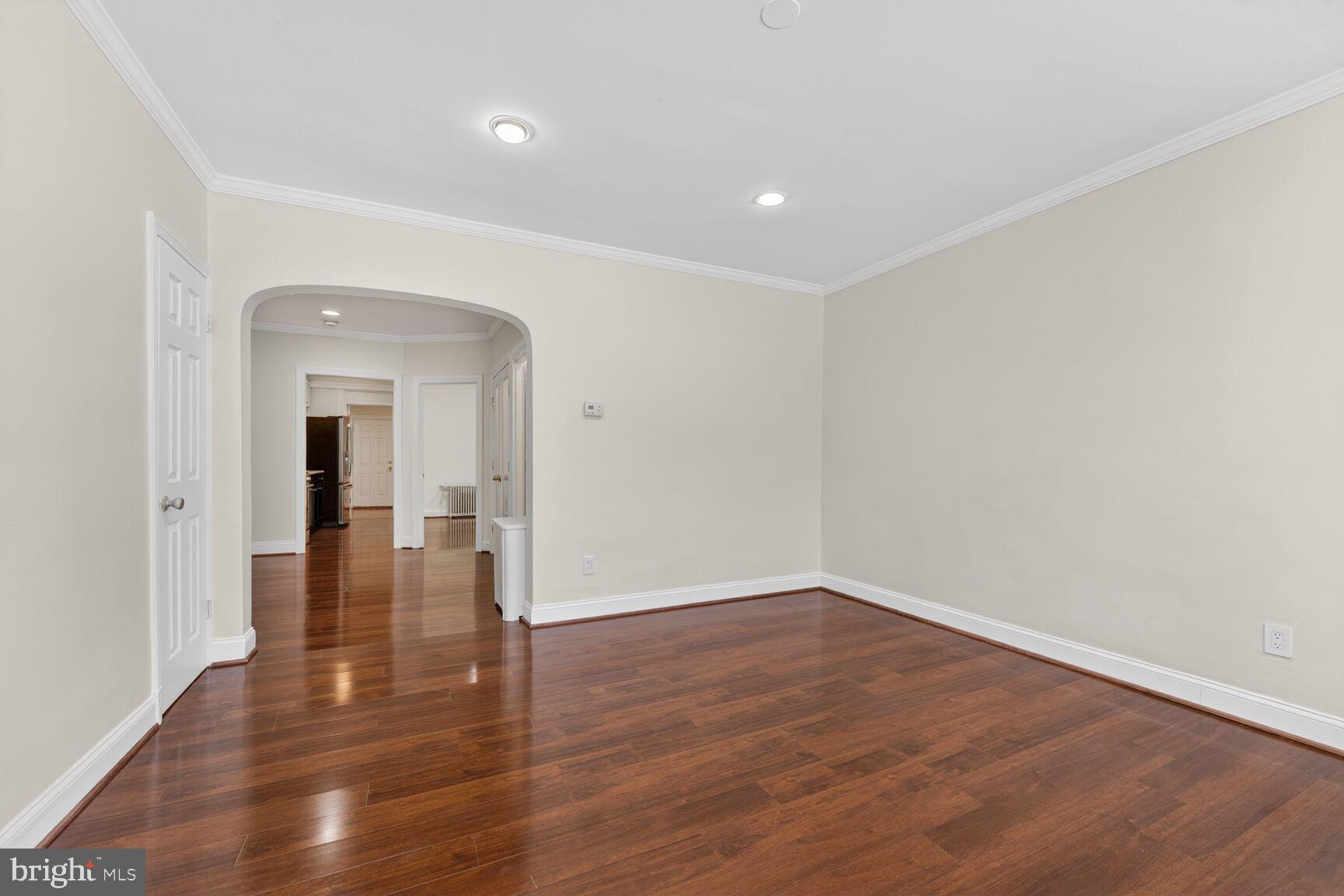 1618 18th Street Southeast, Unit 1 Washington, DC 20020 - Photo 8 of 21 wooden floor in an empty room with a window