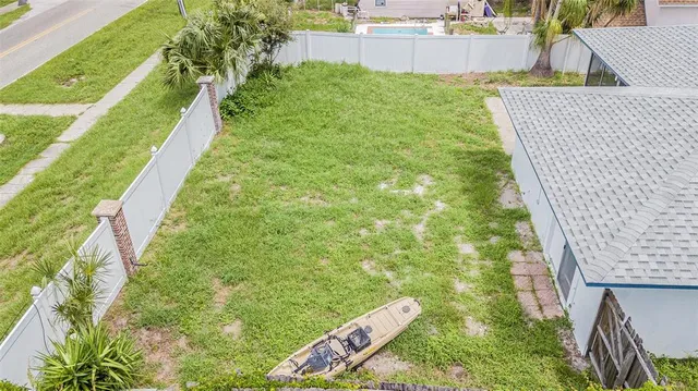 a aerial view of a house with roof deck front of house