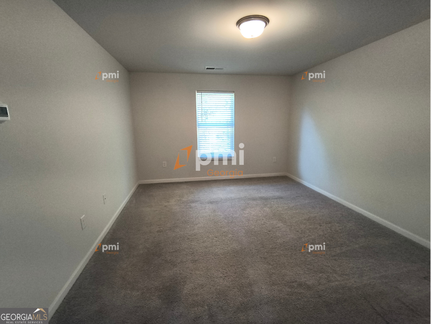 1552 Austin Drive Macon, GA 31217 - Photo 5 of 14 an empty room with windows