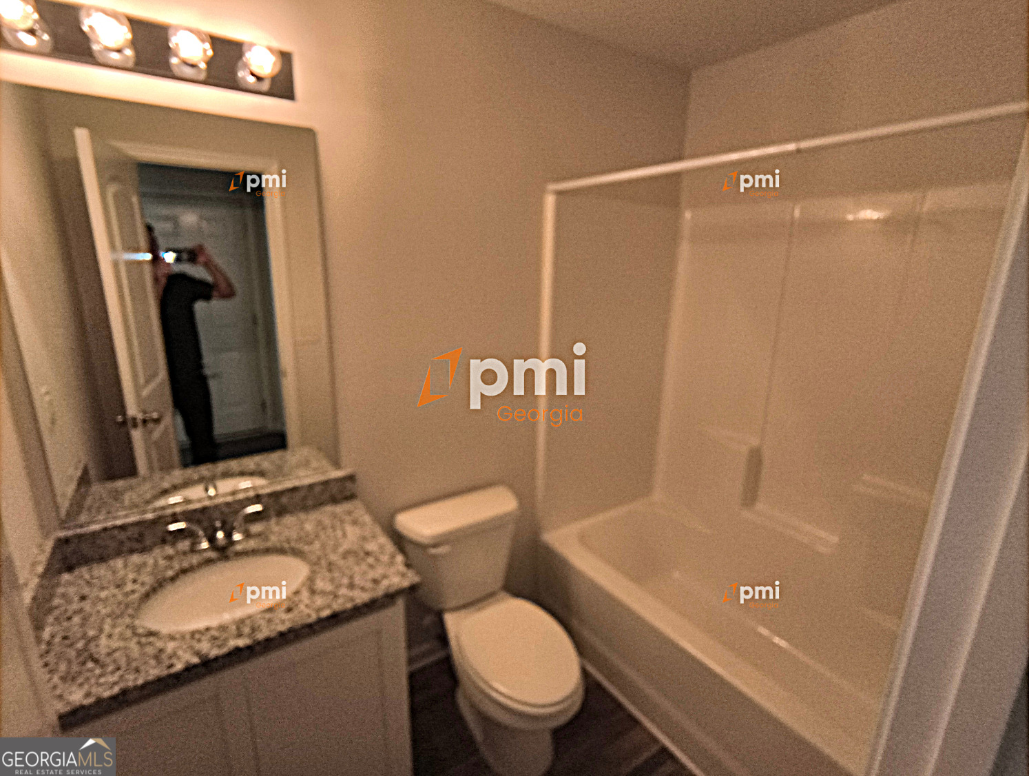 1552 Austin Drive Macon, GA 31217 - Photo 9 of 14 a bathroom with a granite countertop sink toilet and shower