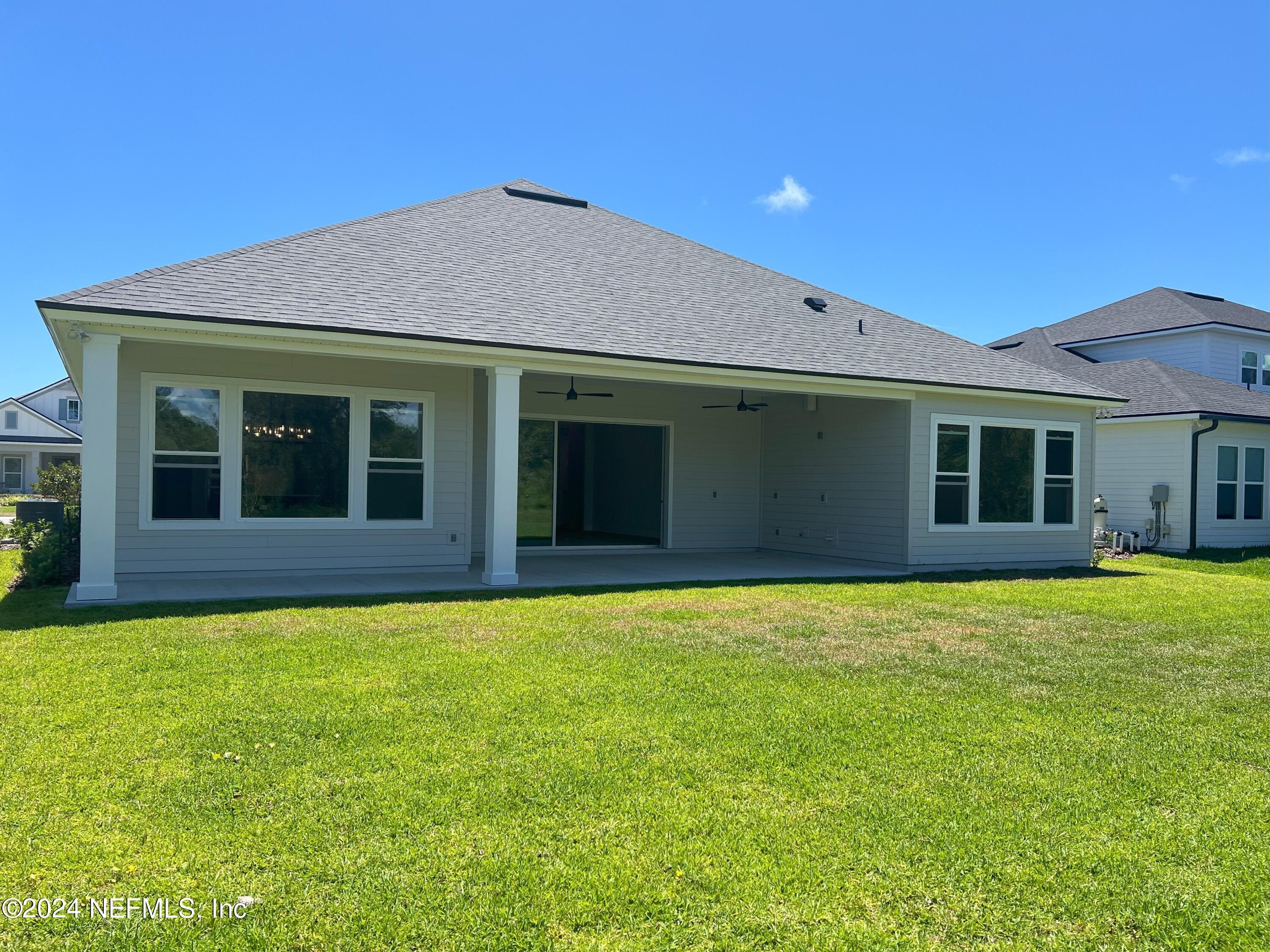 200 Tesoro Terrace St. Augustine, FL 32095 - Photo 22 of 32 a house that has a big yard with large trees