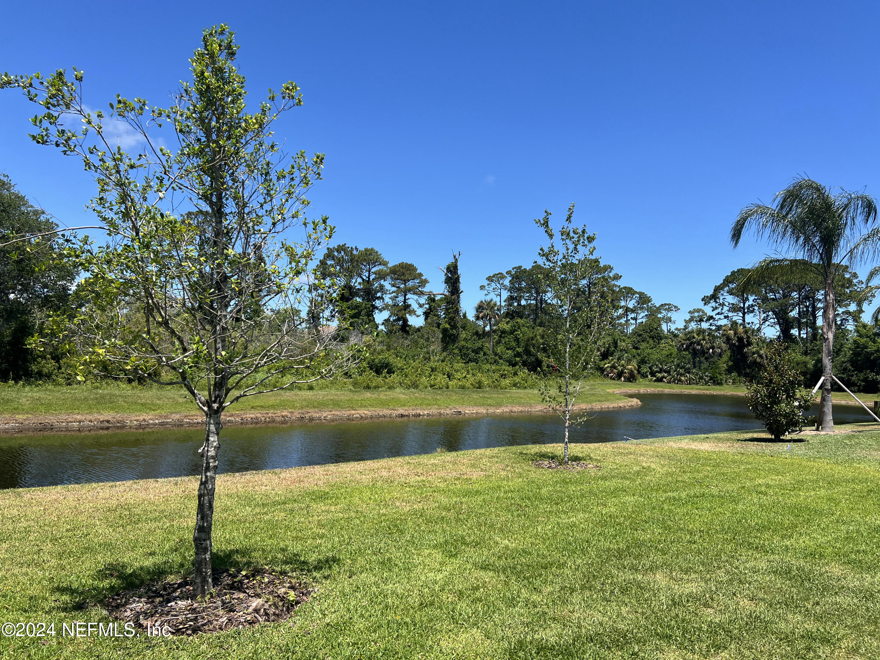 200 Tesoro Terrace St. Augustine, FL 32095 - Photo 26 of 32 a view of a lake with a big yard