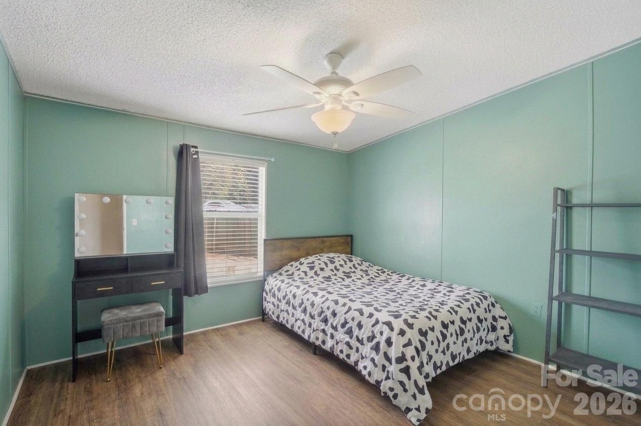 605 Ridgewood Court Mount Holly, NC 28120 - Photo 16 of 32 a bedroom with a bed and a table in it