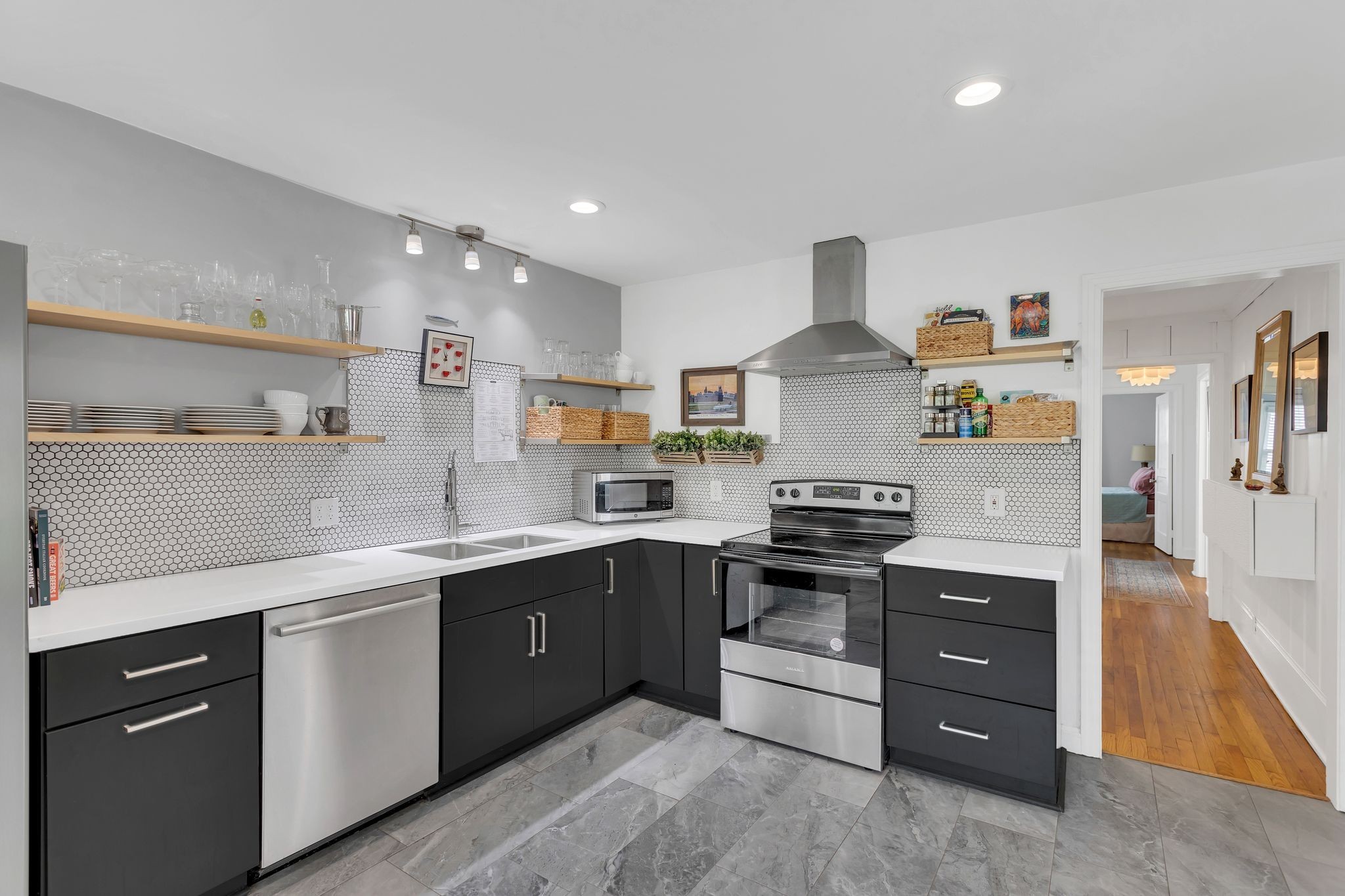 a kitchen with stainless steel appliances granite countertop a stove and a sink