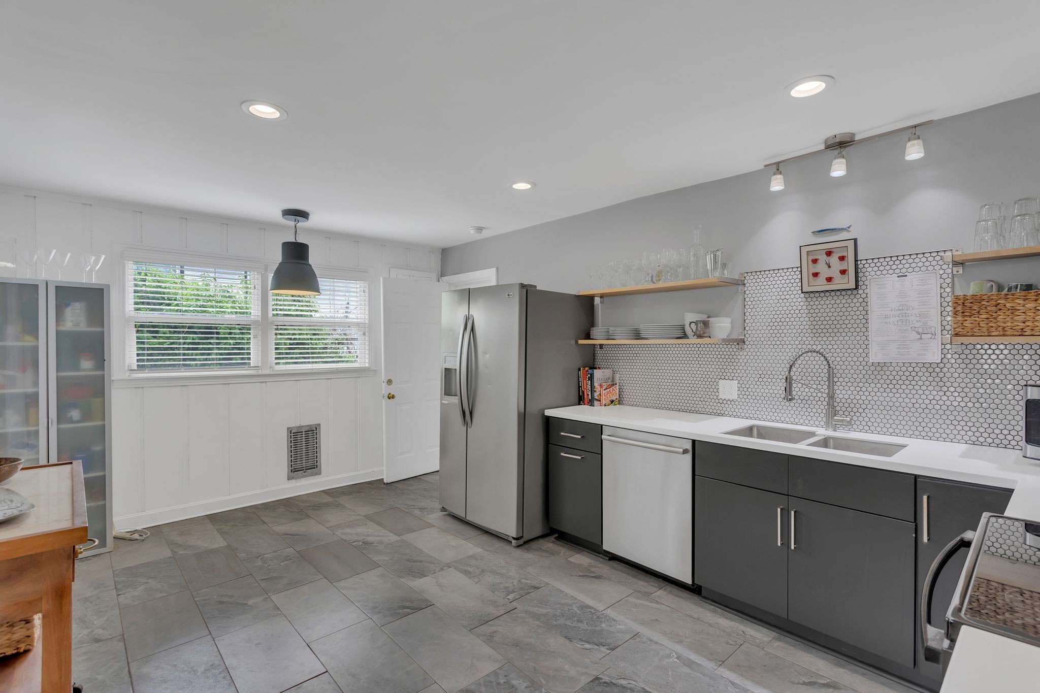 724 Dover Road Nashville, TN 37211 - Photo 11 of 32 a kitchen with a sink window and refrigerator