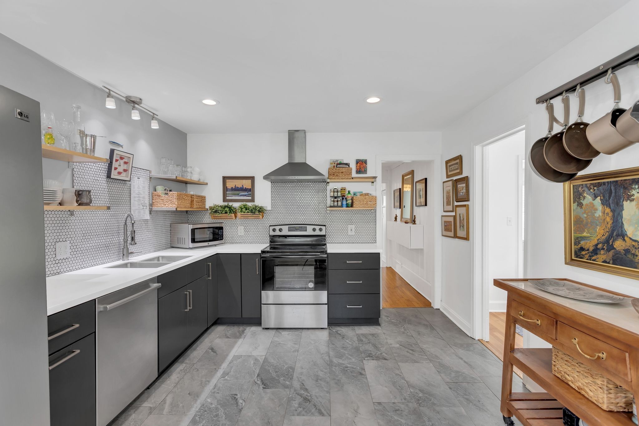 724 Dover Road Nashville, TN 37211 - Photo 12 of 32 a kitchen with stainless steel appliances granite countertop a stove and a sink