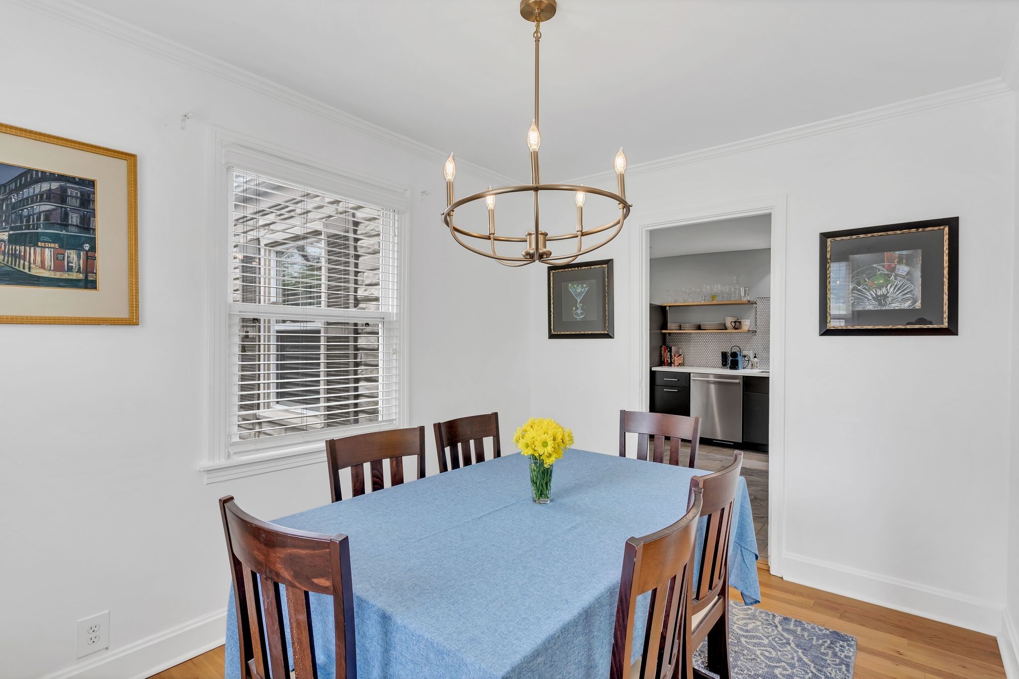 724 Dover Road Nashville, TN 37211 - Photo 9 of 32 a view of a dining room with furniture a chandelier and wooden floor