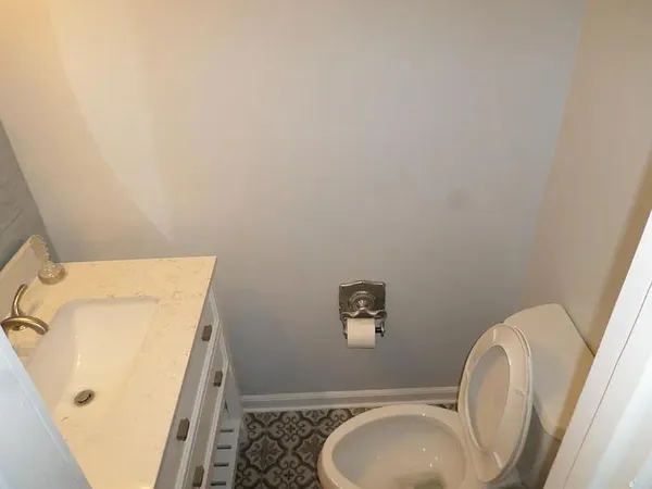 a bathroom with a toilet and a sink