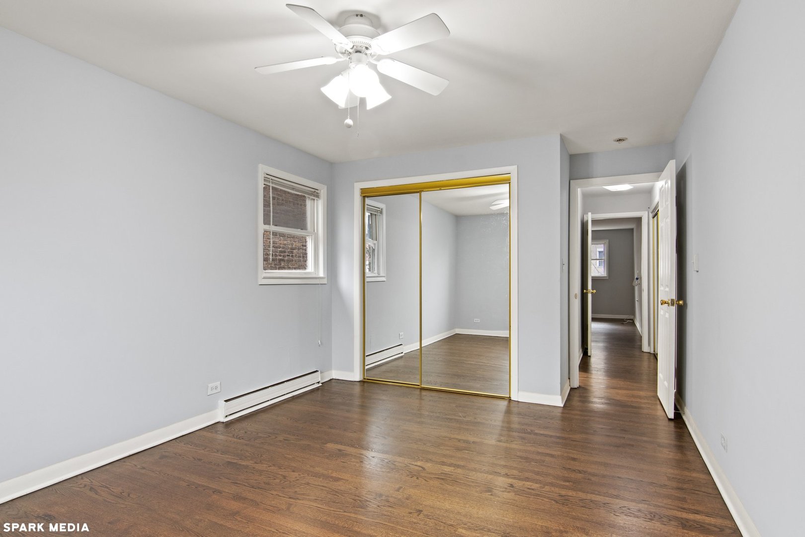 8847 La Crosse Avenue, Unit 204 Skokie, IL 60077 - Photo 12 of 16 wooden floor in an empty room with a window