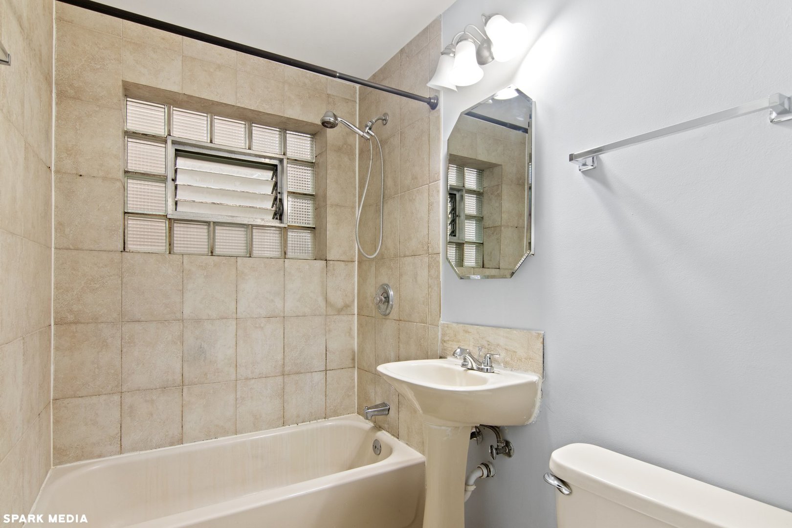 8847 La Crosse Avenue, Unit 204 Skokie, IL 60077 - Photo 13 of 16 a bathroom with a sink a toilet and shower