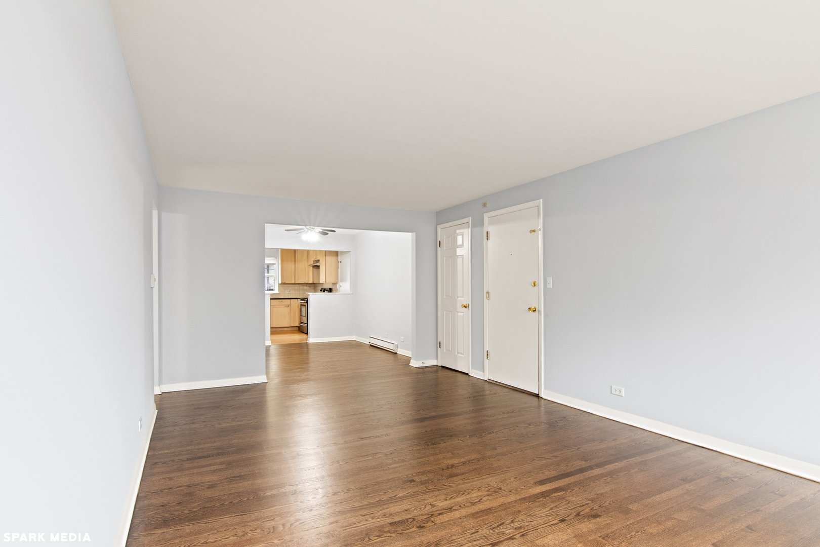 8847 La Crosse Avenue, Unit 204 Skokie, IL 60077 - Photo 4 of 16 a view of an empty room with wooden floor
