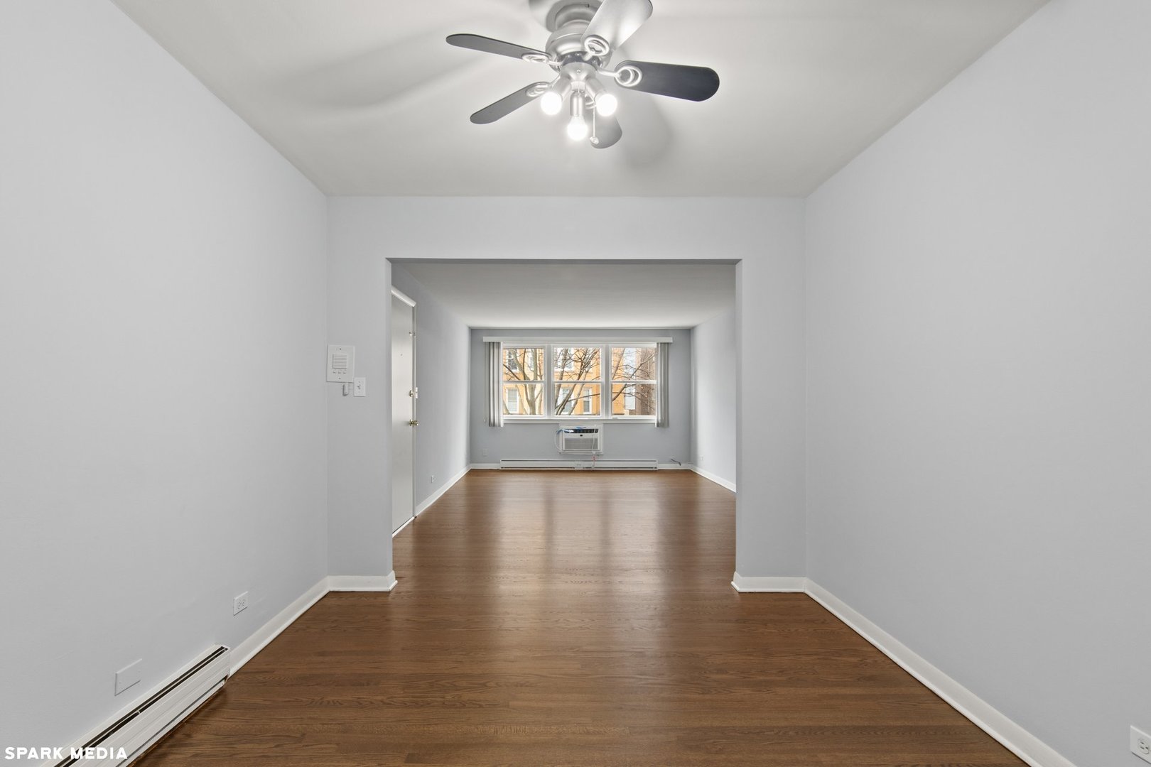 8847 La Crosse Avenue, Unit 204 Skokie, IL 60077 - Photo 7 of 16 a view of an empty room with window and wooden floor