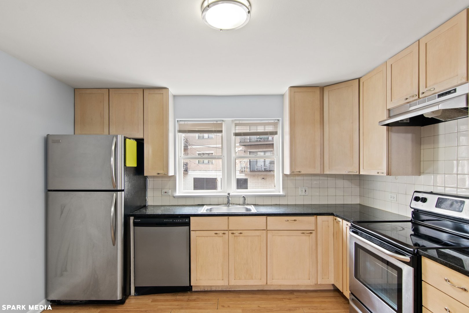 8847 La Crosse Avenue, Unit 204 Skokie, IL 60077 - Photo 8 of 16 a kitchen with a refrigerator and a sink