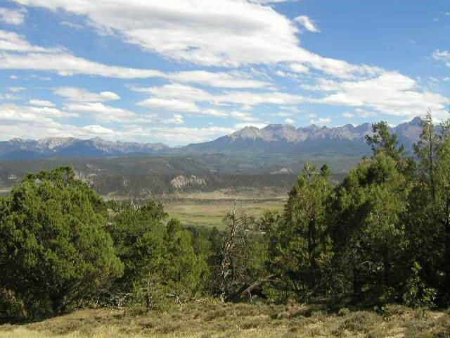 Lot#12 Mcclure Road Ridgway, CO 81432 - Photo 5 of 9 a view of a lake with mountains in the background