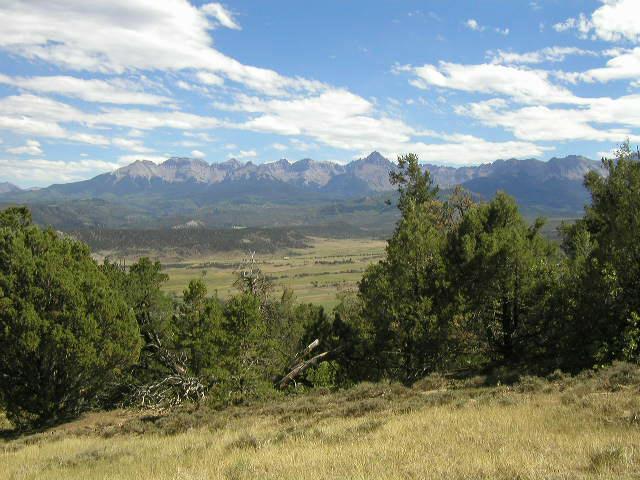 Lot#12 Mcclure Road Ridgway, CO 81432 - Photo 6 of 9 a view of a lake with mountains in the background