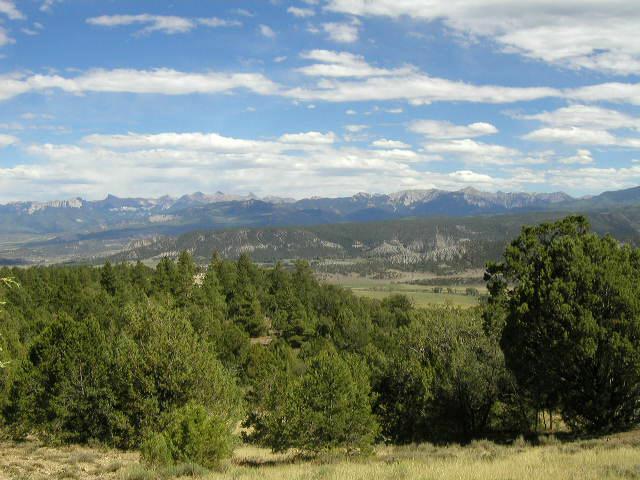 Lot#12 Mcclure Road Ridgway, CO 81432 - Photo 7 of 9 a view of a lake with mountains in the background